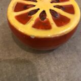 Vintage salt shaker in the shape of an orange marked ermetic