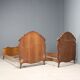 Simple old baroque-style beds in various woods from the 20th century.