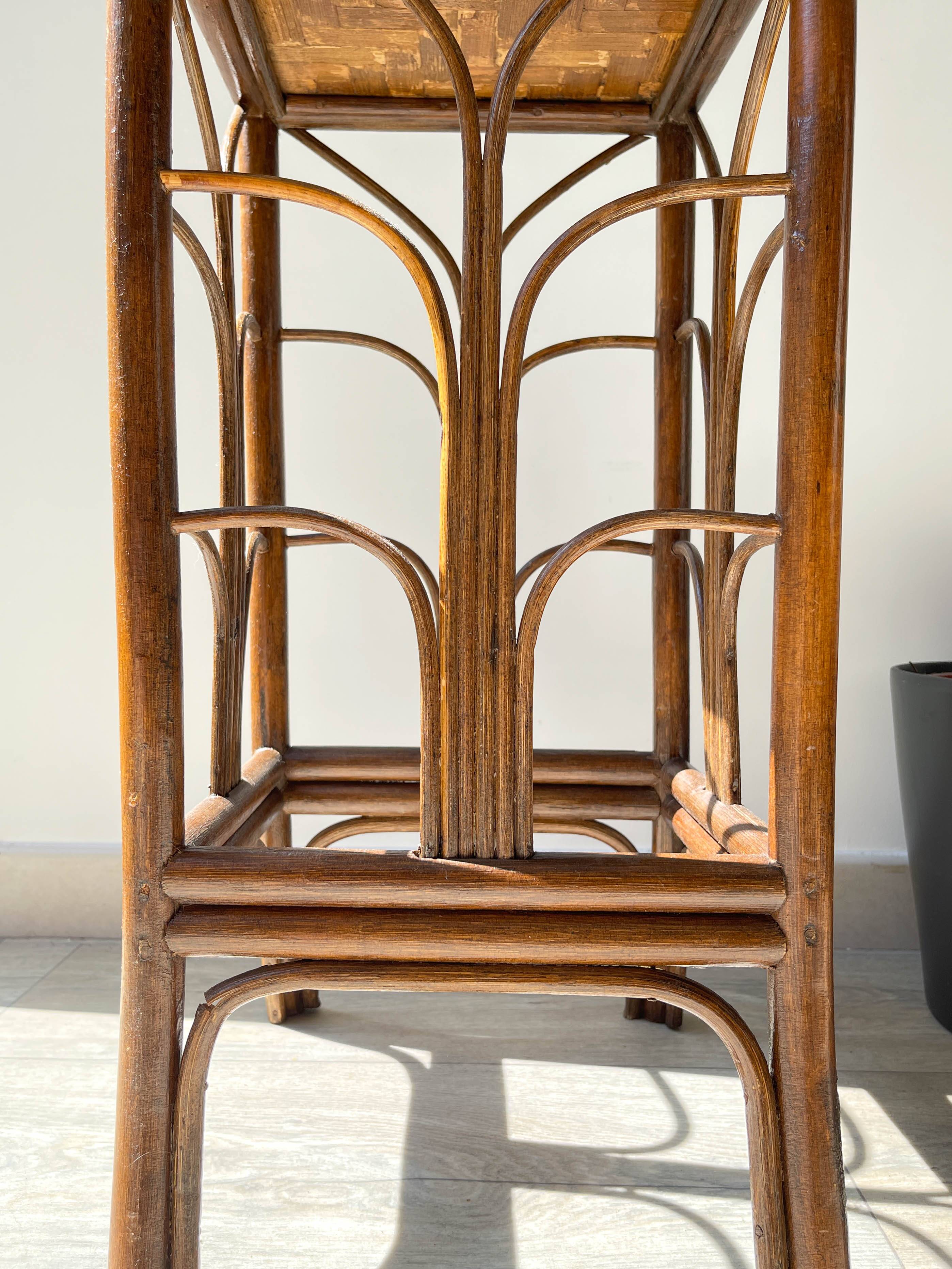 Vintage rattan plant stand in Art Deco style