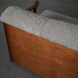Modern Swedish two-seater independent sofa bed in pine and lambswool, 1950s.