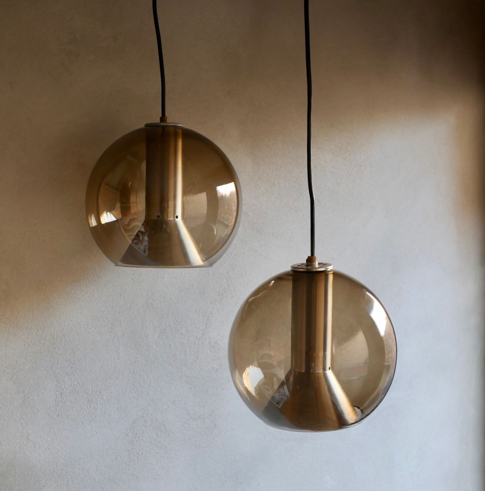 Pair of raak Amsterdam globe suspensions