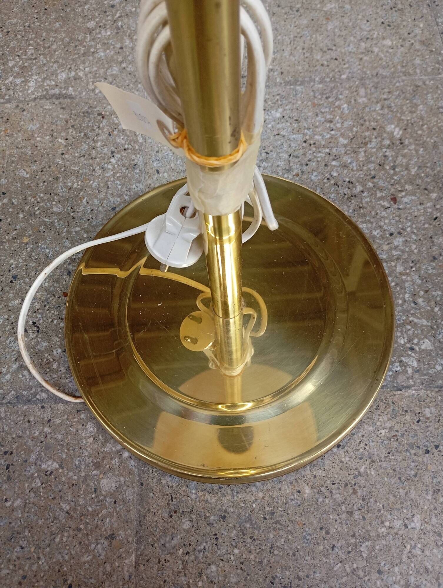 Vintage floor lamp with a gold base.