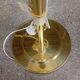 Vintage floor lamp with a gold base.
