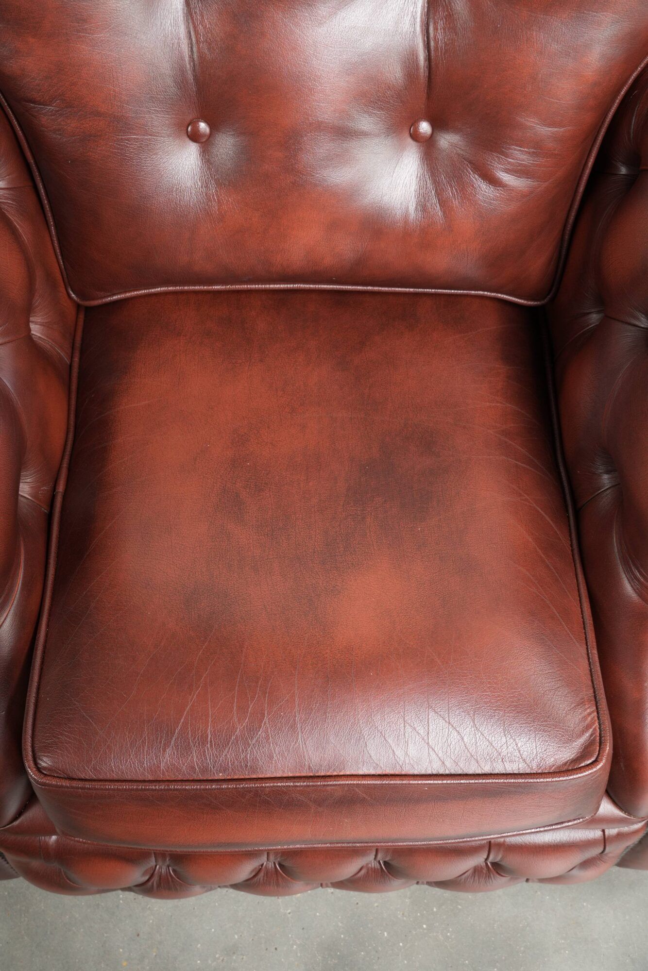 Brown cow leather Chesterfield armchair in a unique design