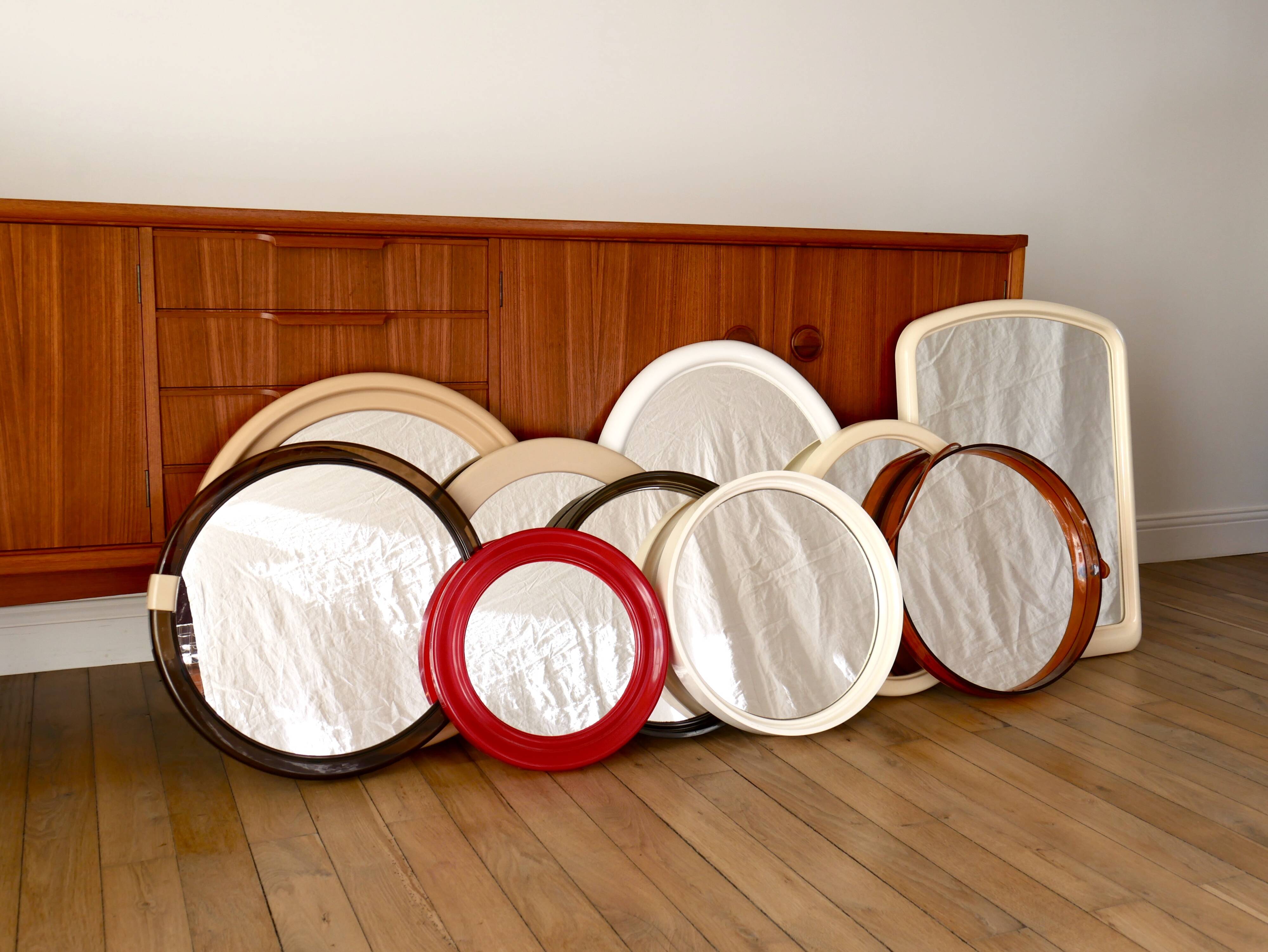 Large round mirror in pink beige plastic from the 70s