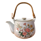 Vintage teapot in stoneware handle in rattan
