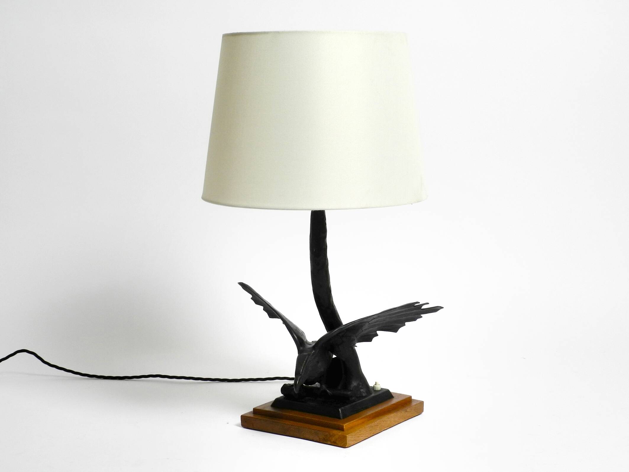 1940s table lamp made of iron in the shape of an eagle, teak wooden base