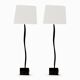 Pair of hammered black metal floor lamps with white shades.