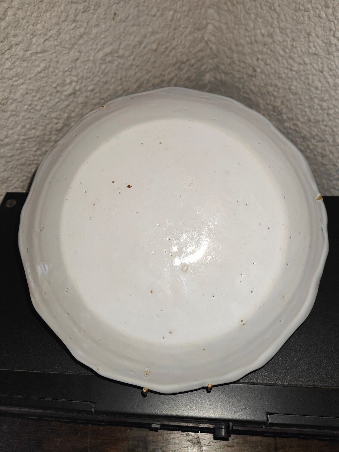 Old plate in Northern earthenware with blue floral decoration eighteenth century