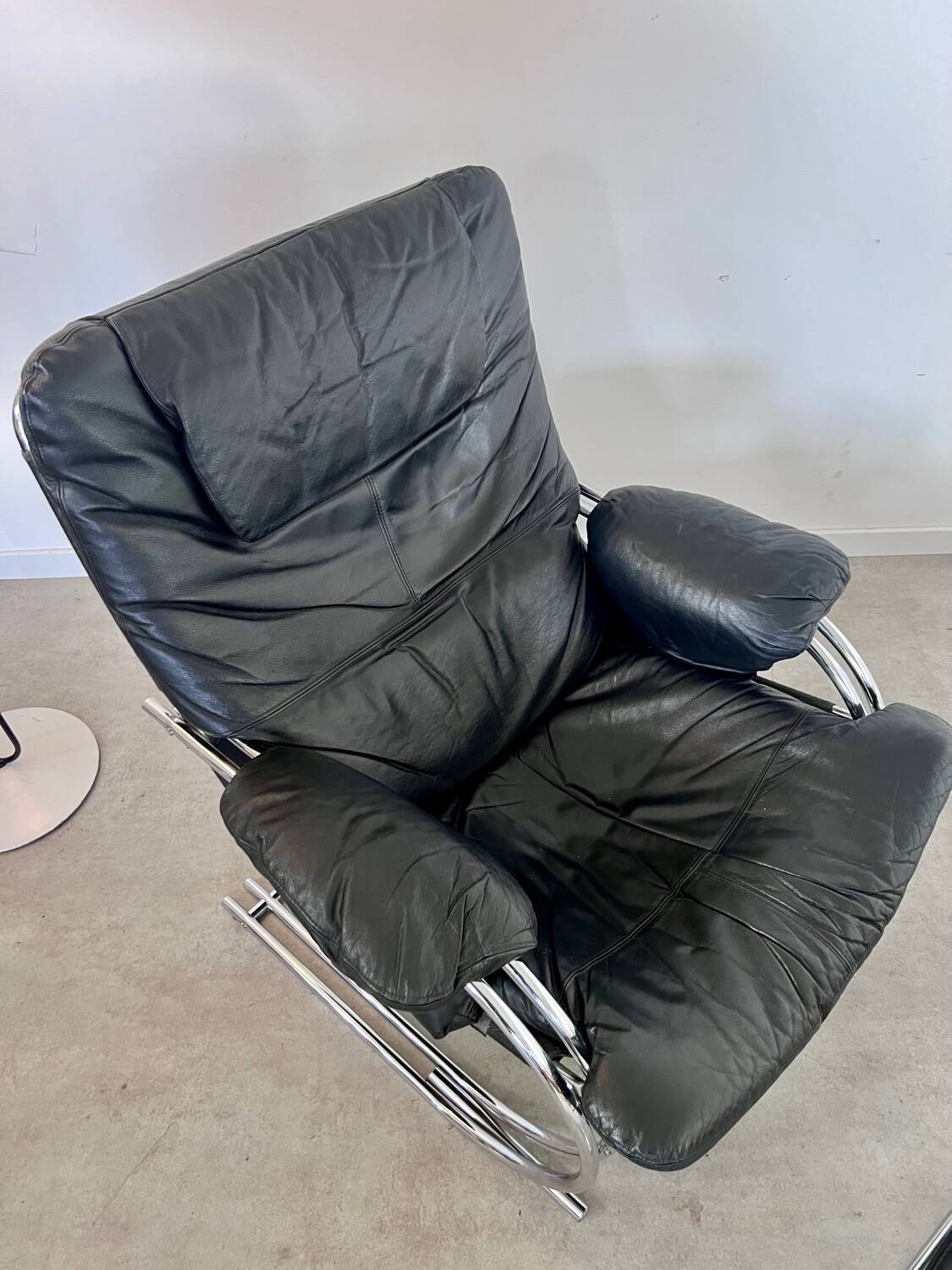 Old armchair and ottoman black leather tubular chrome bauhaus design from the 70s