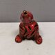 Beautiful seal in ceramic with metallic red glaze.