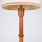 Pair of turned wooden floor lamps in Art Deco style, France, mid-20th century.