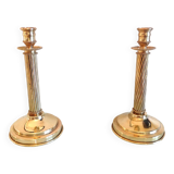 Pair of empire style brass candlesticks