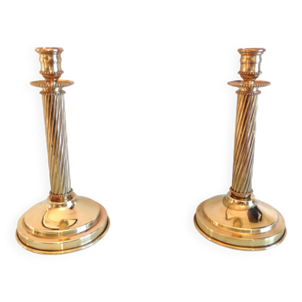 Pair of empire style brass candlesticks