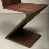 Gerrit Rietveld Zig Zag Chair is dark brown stained wood
