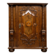 Ornamental piece of solid wood furniture, richly carved, dating from the 17th century.