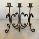 Trio of wrought iron candlesticks