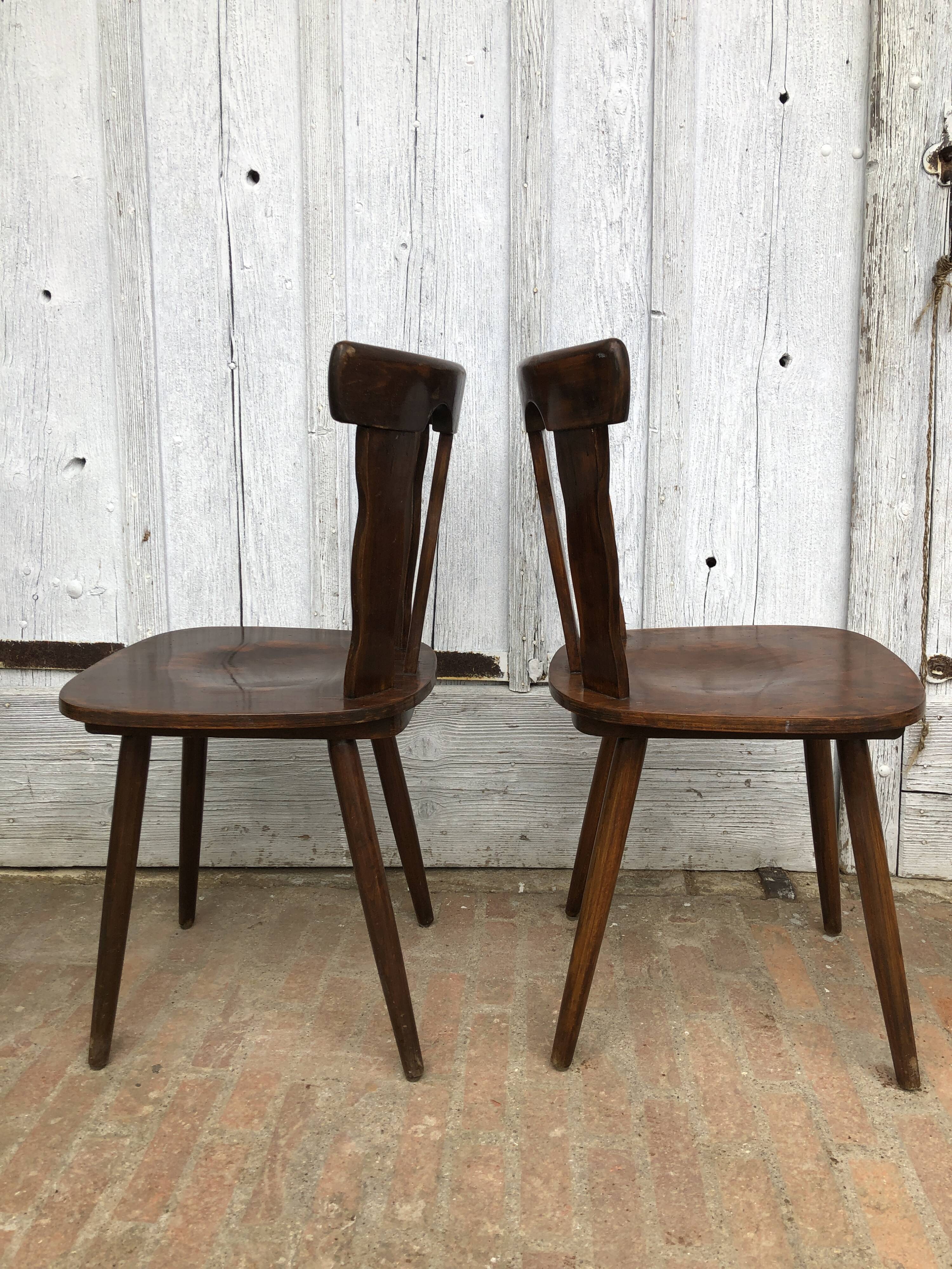 4 brutalist-style wooden chairs