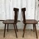 4 brutalist-style wooden chairs