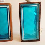 Two Swedish table lamps in solid pressed blue glass and teak wood "frame".