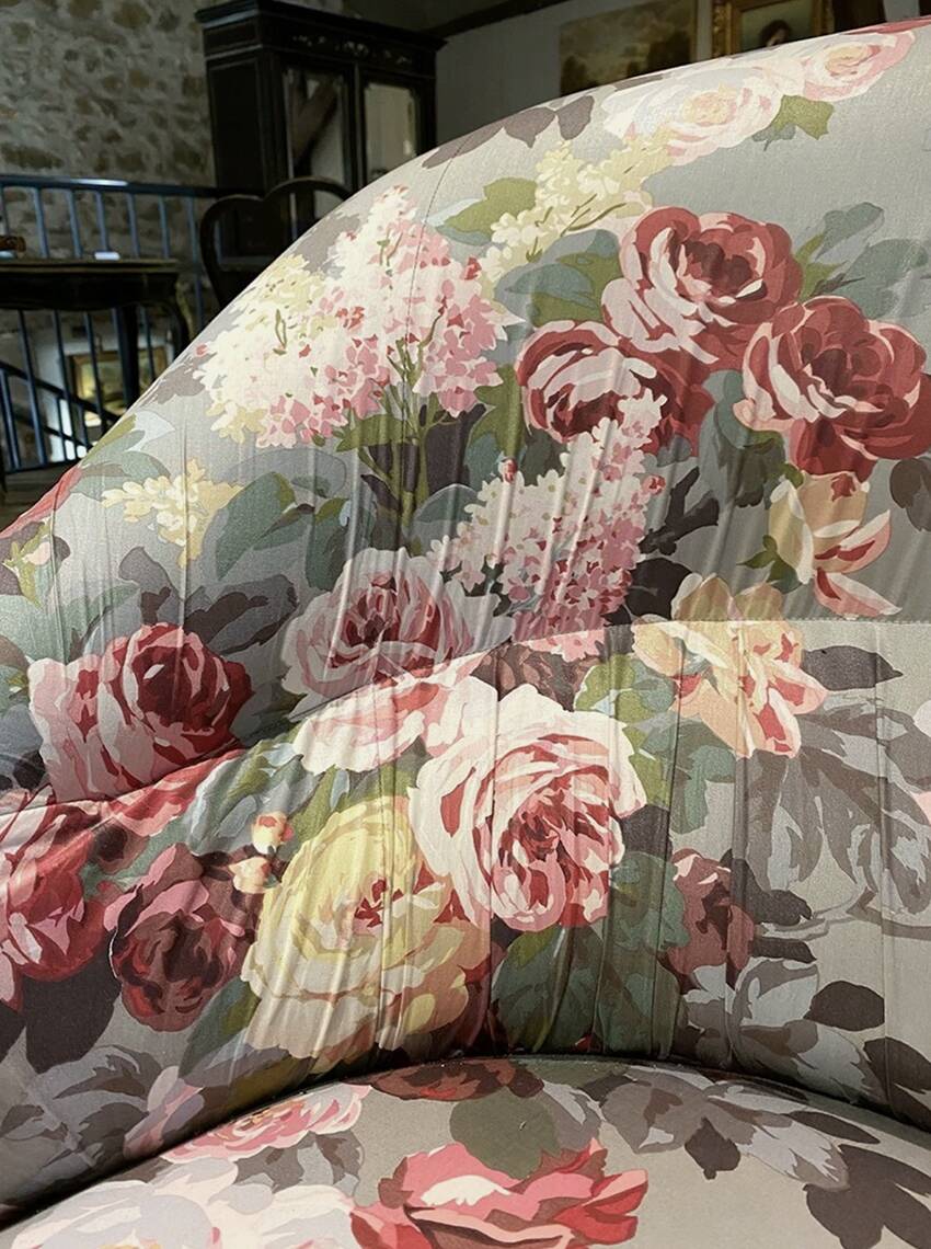 Napoleon III sofa upholstered in a floral patterned fabric