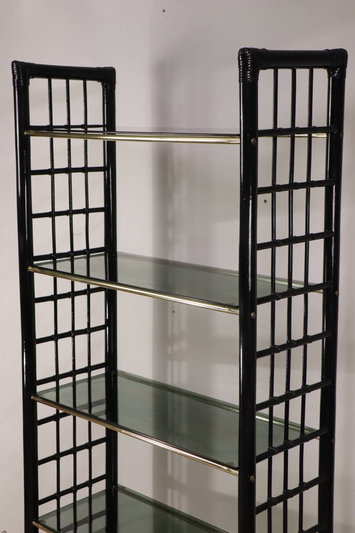 Vintage 1970s shelf in smoked glass with a bamboo-style structure.
