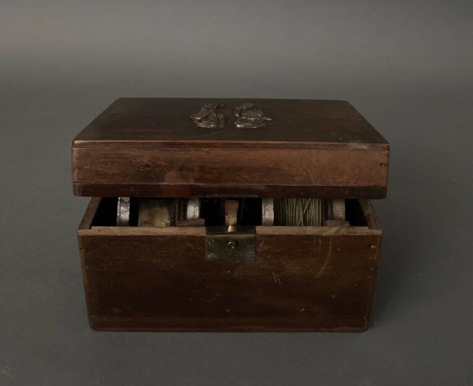 Two reel spools in their original 1900 box