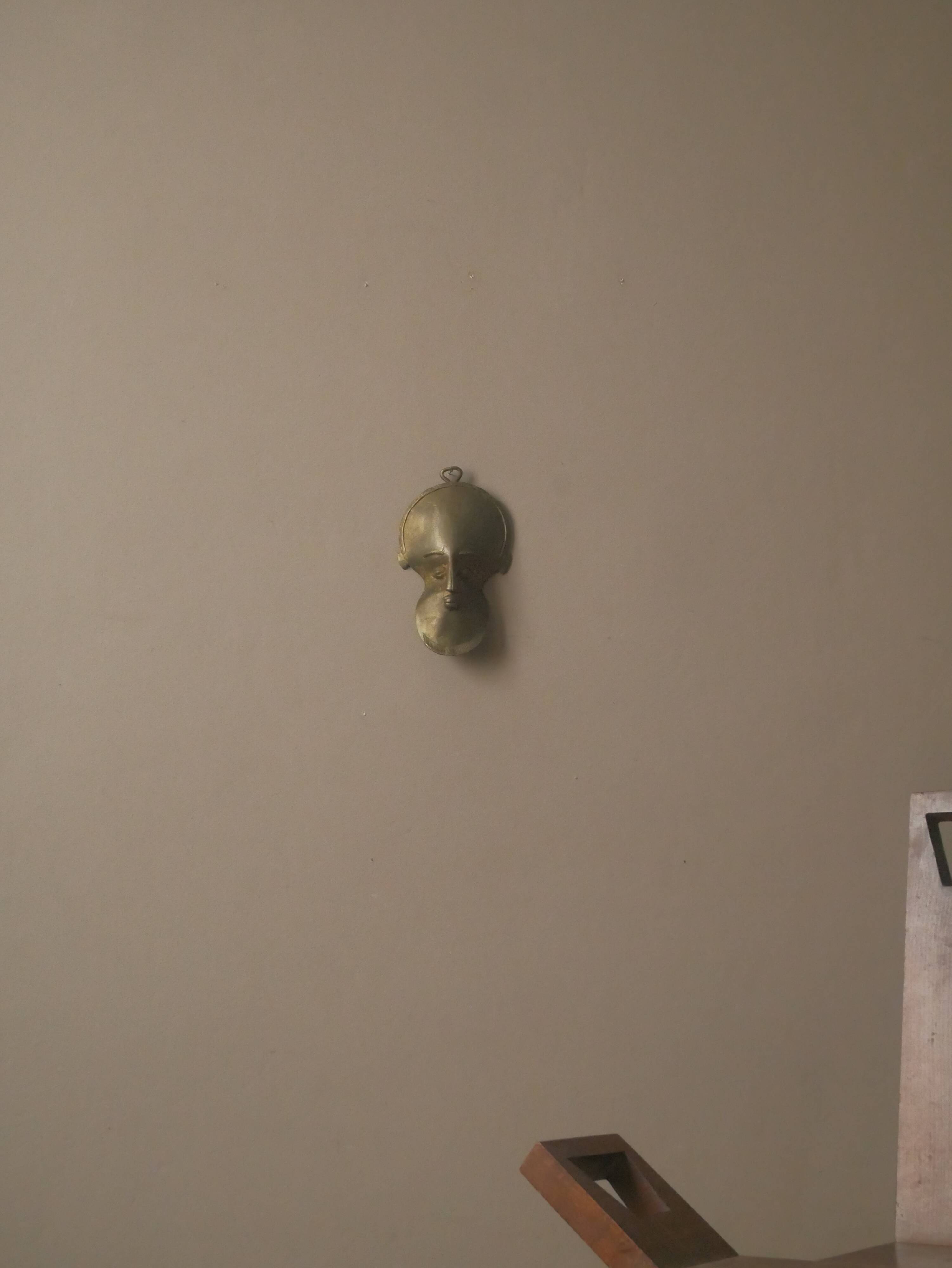 Brass mask wall sculpture tribal decorative object African art handmade vintage