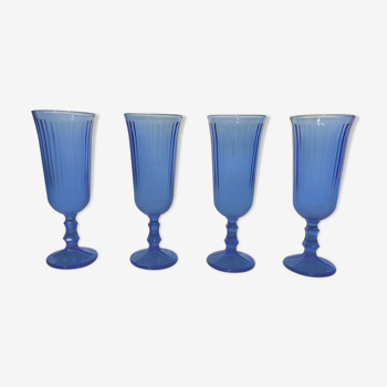 Champagne flutes in blue glass