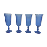 Champagne flutes in blue glass