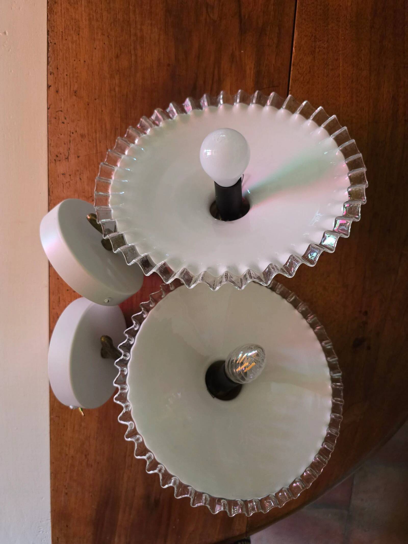 Pair of wall sconces in brass and wavy opaline glass