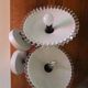 Pair of wall sconces in brass and wavy opaline glass