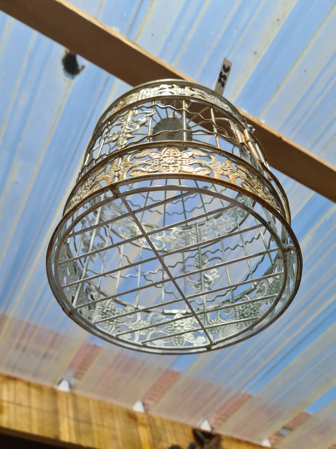 Round weathered iron birdcage