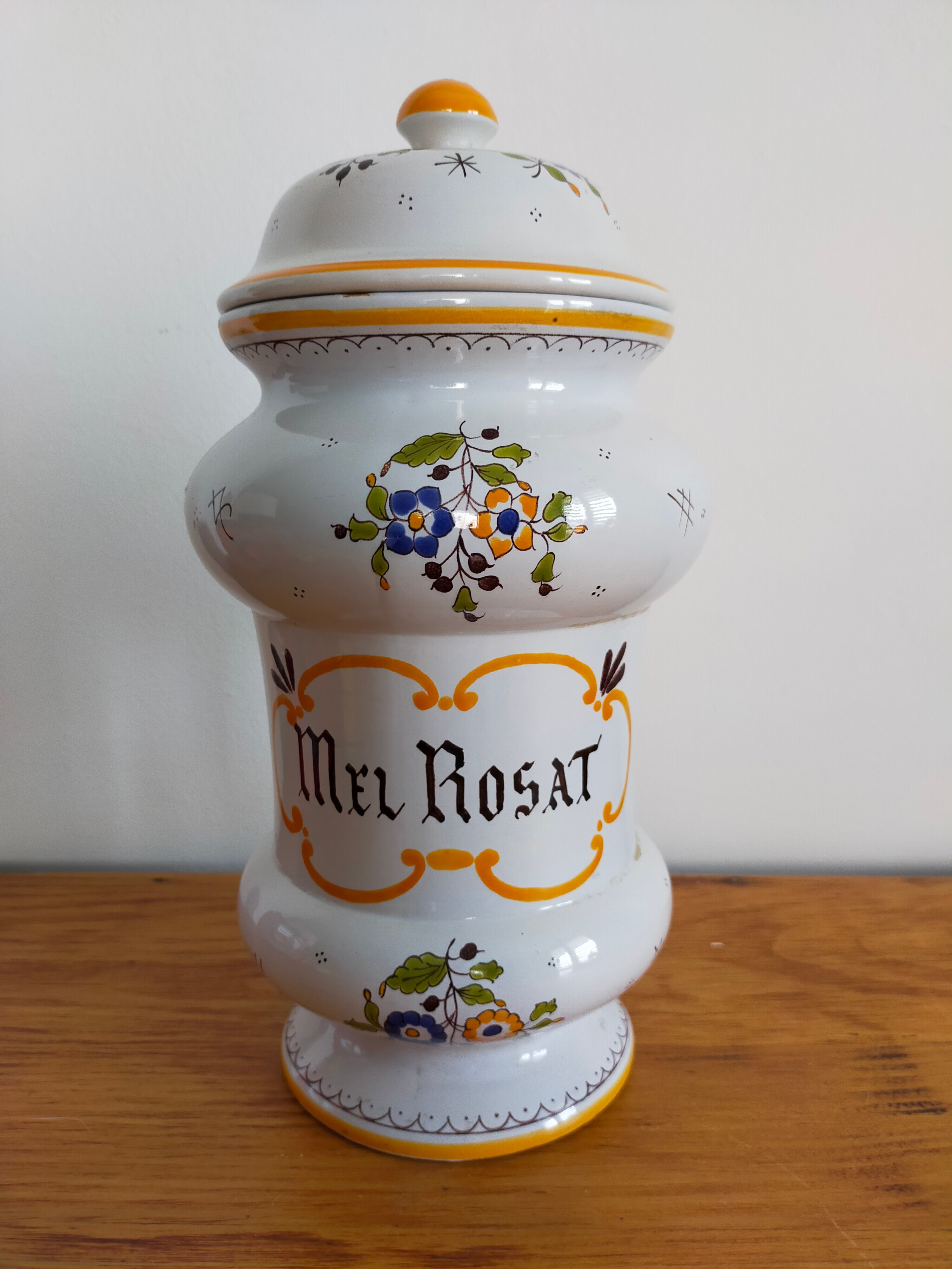 Vintage antique pharmacy jar in earthenware floral patterns