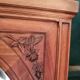 Old oval walnut wood mirror has flower carvings decoration