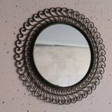 Large round vintage mirror in black metal with green patina