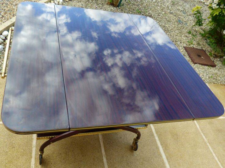 Chic serving table on wheels from the 60s with brass decorations and two shelves.