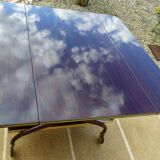 Chic serving table on wheels from the 60s with brass decorations and two shelves.