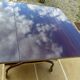 Chic serving table on wheels from the 60s with brass decorations and two shelves.
