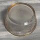 Set of 3 glass bowls with gold embellishments.