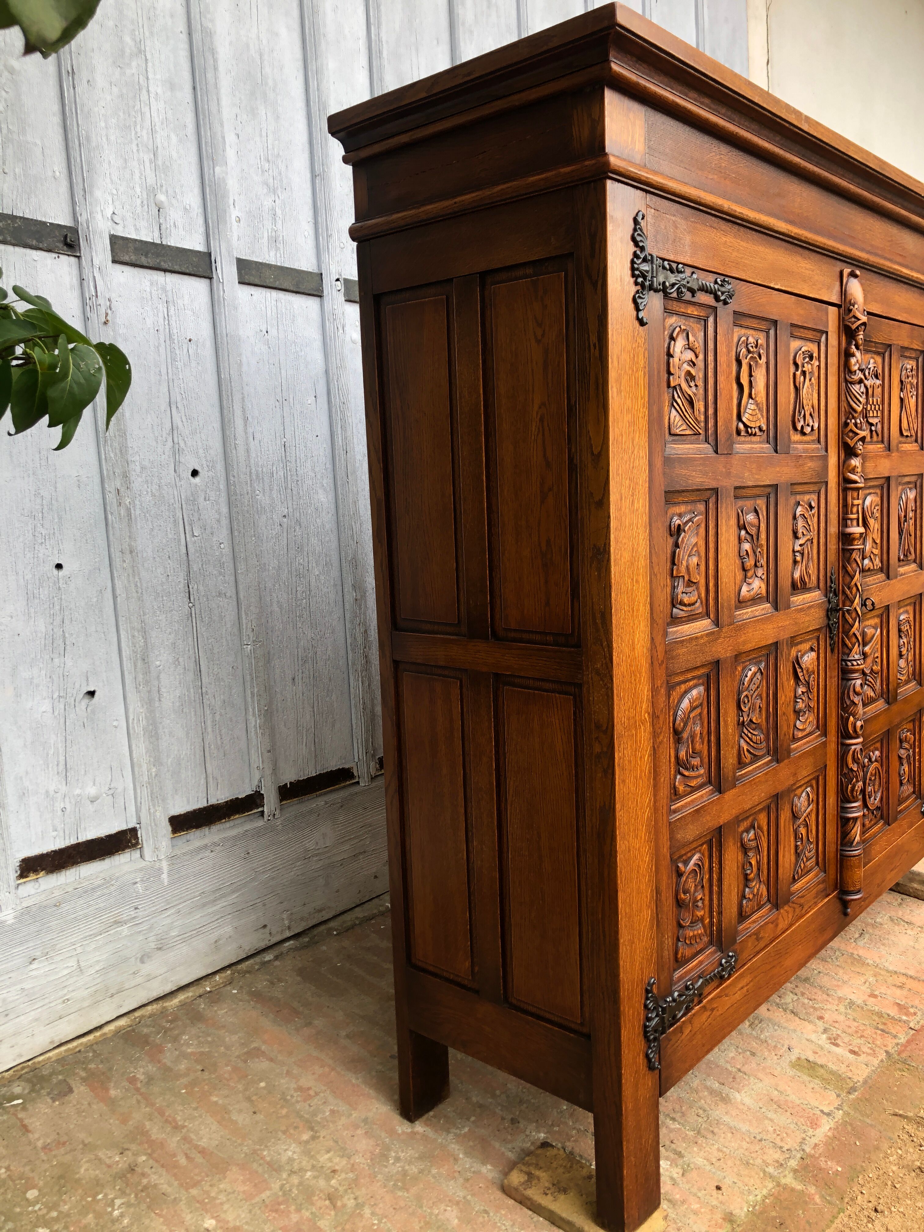 Spanish furniture with carved wood profiles and coats of arms from the 1950s.