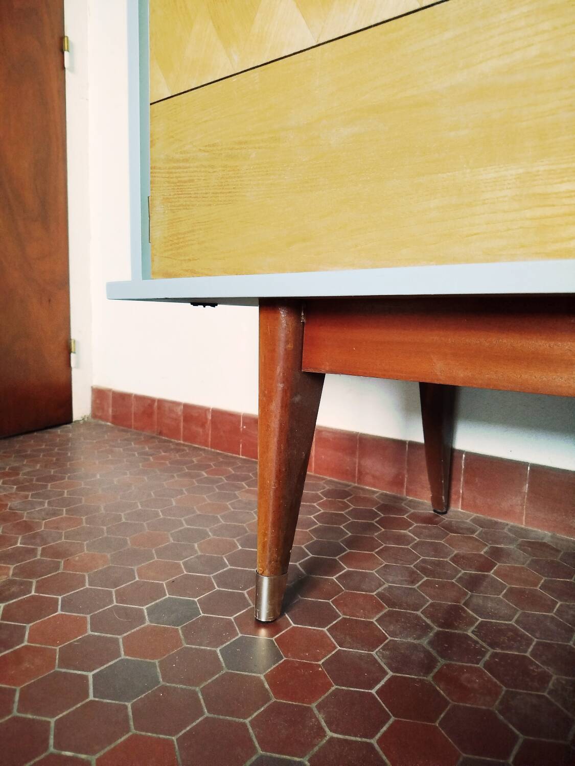 Wooden sideboard in soft green