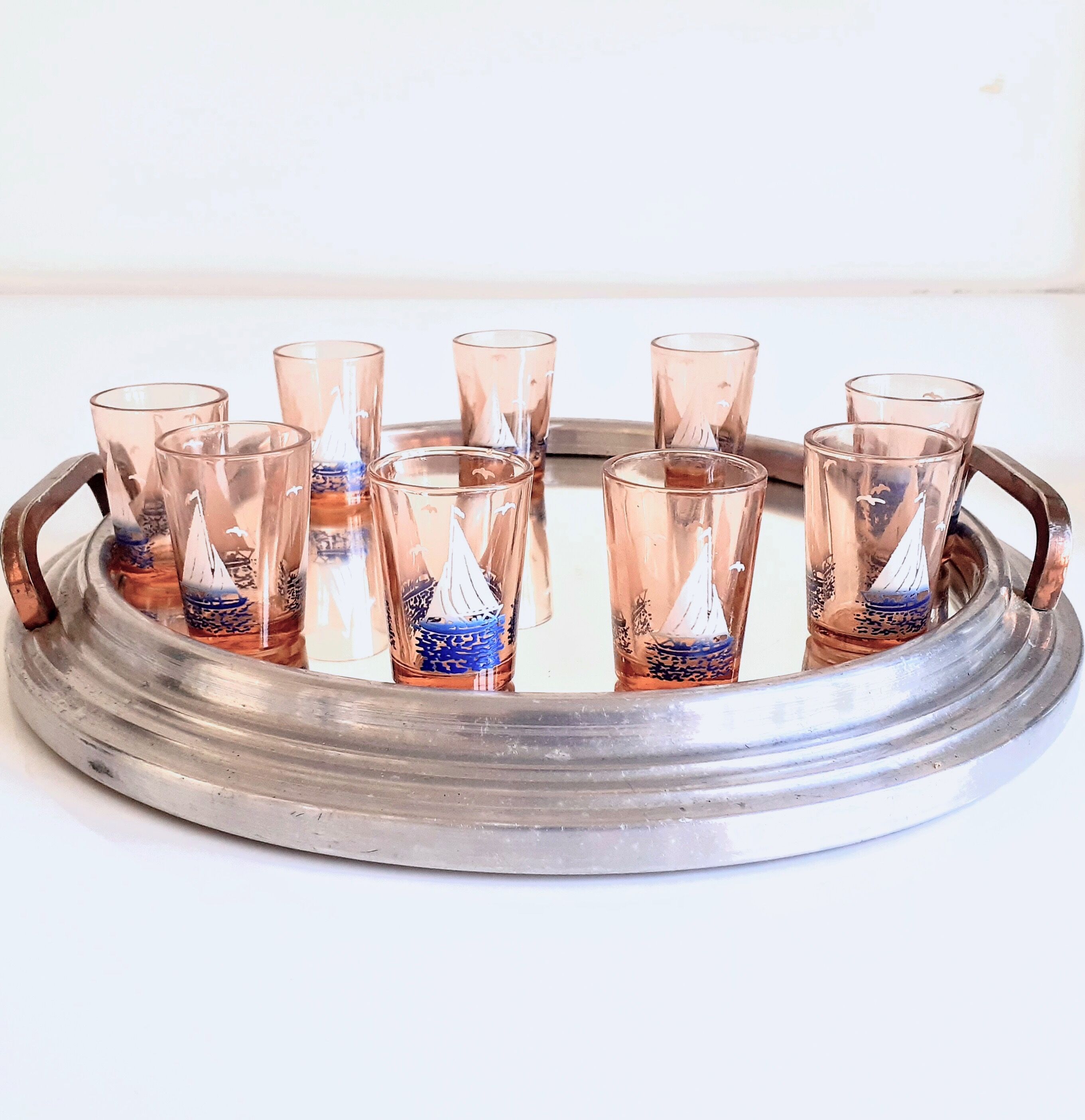 Carafe and 9 liquor glasses decorated with sailboats