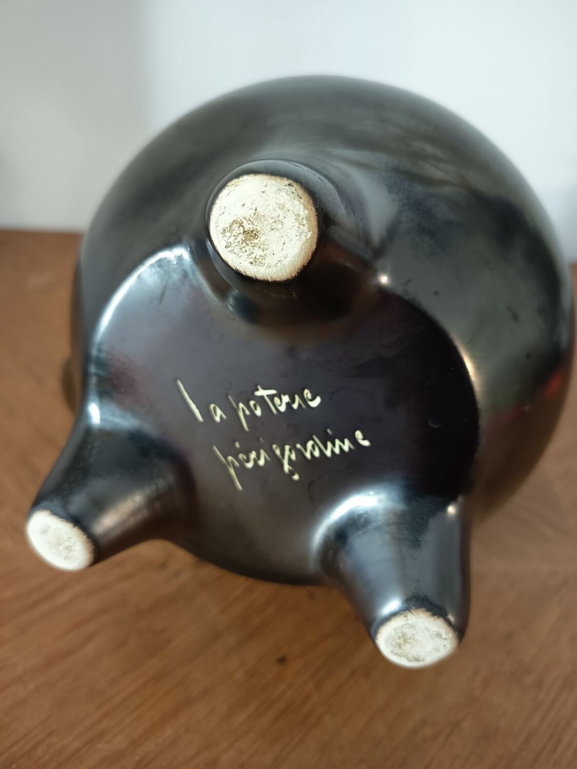 Black ceramic tripod jug