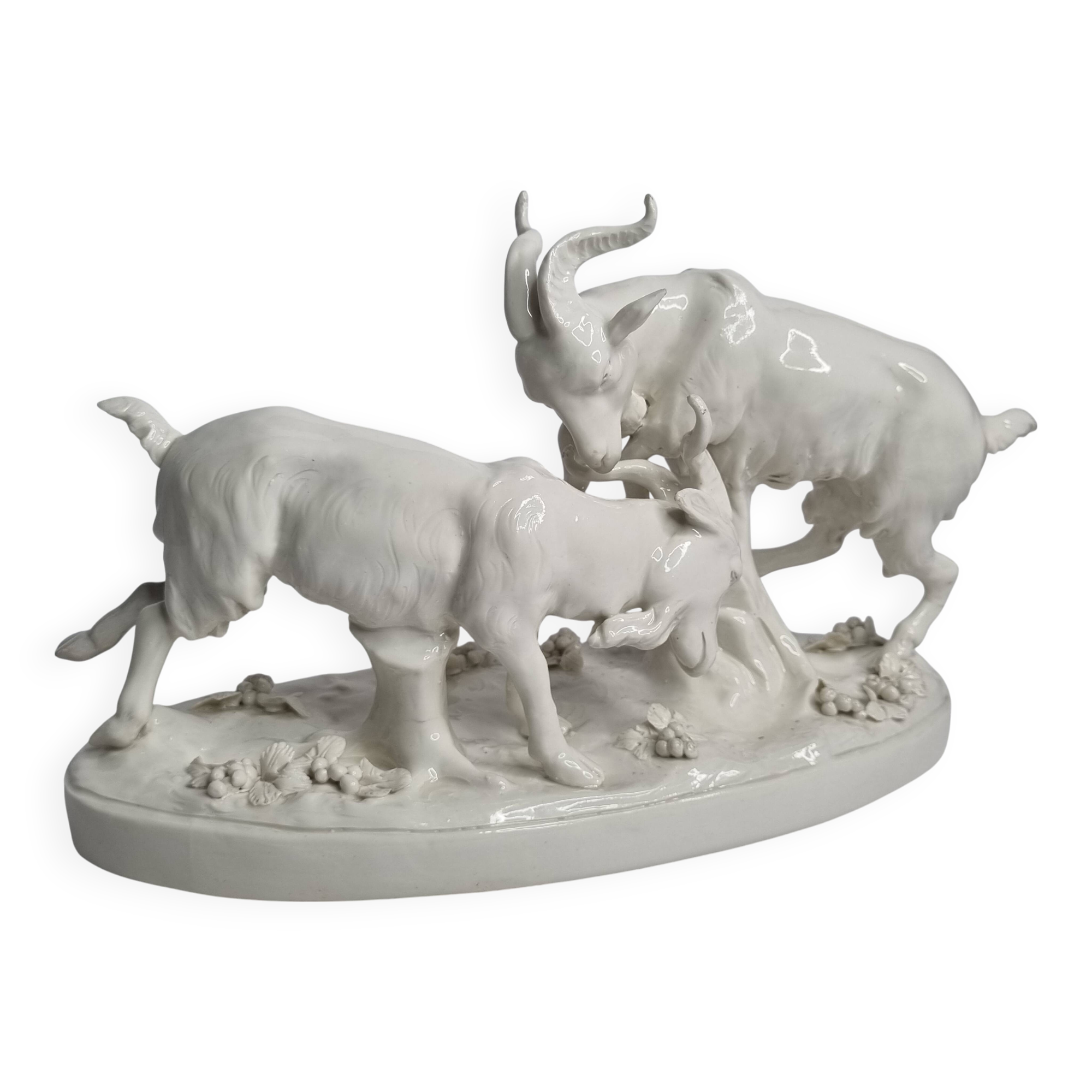 Saxon porcelain group, two fighting goats, signed Röhle, 1900