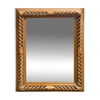 Carved blond wood wall mirror