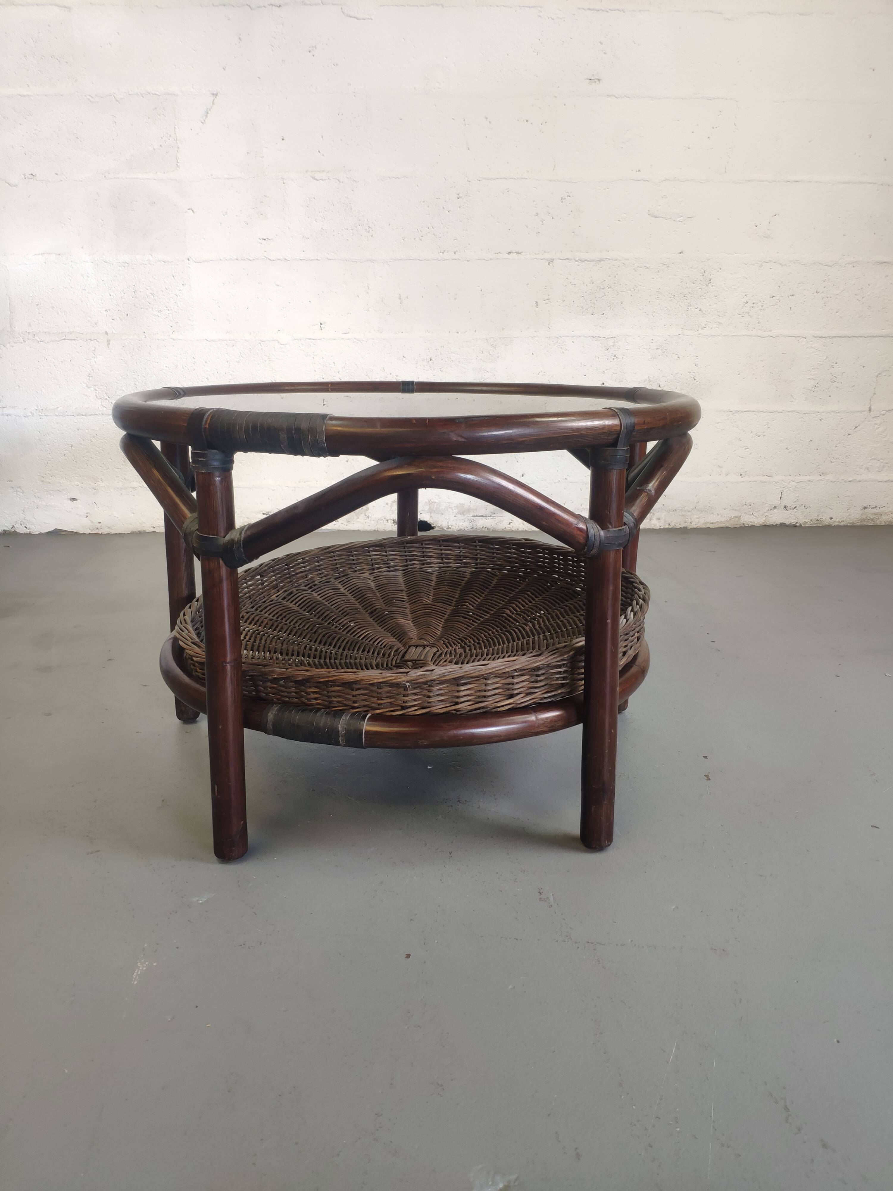 Vintage rattan coffee table with smoked glass top and rattan basket shelf