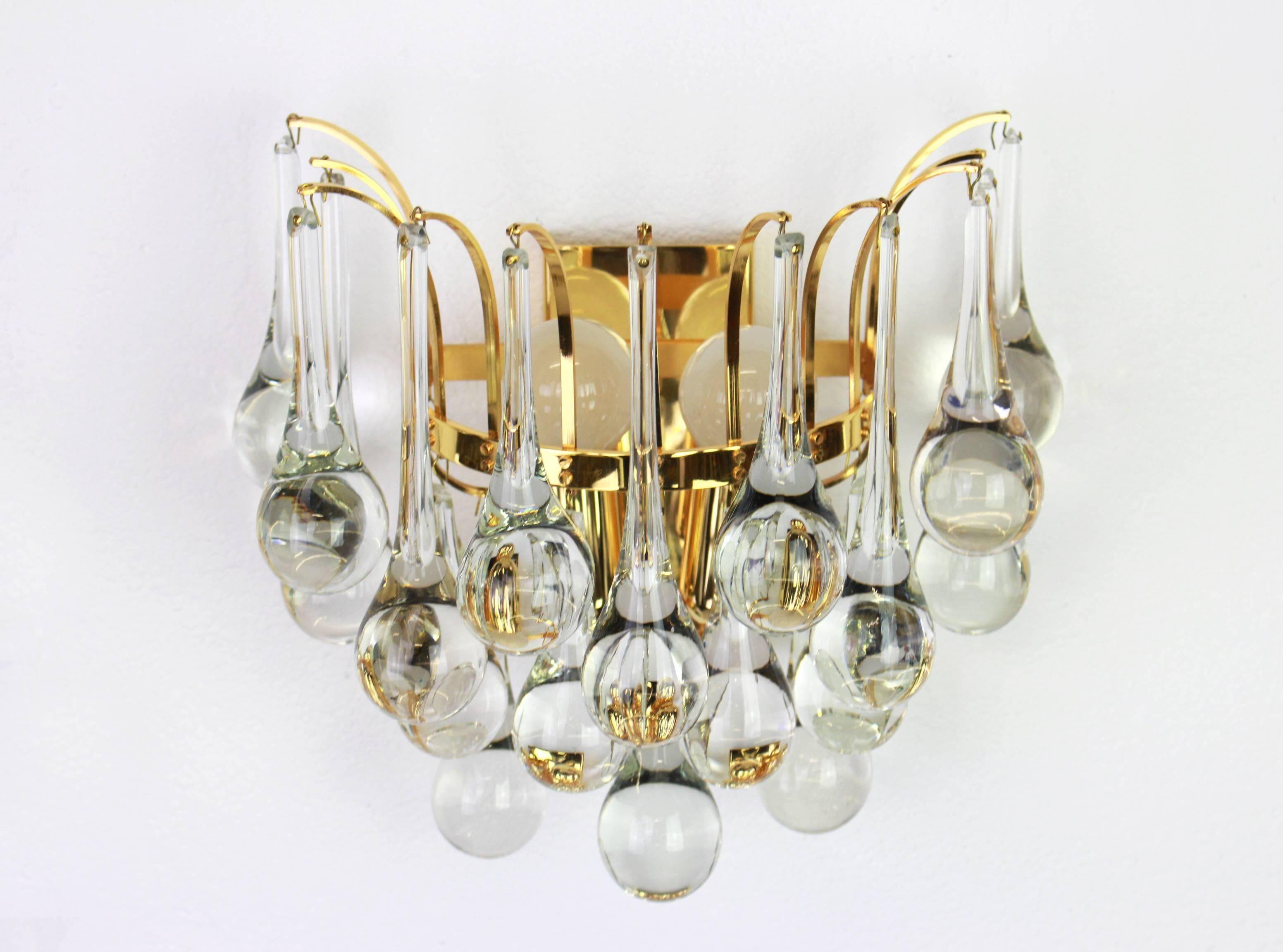 Large pair of gilt brass and crystal wall lights by Palwa, Germany, 1970s.