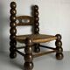 Chaise basse en bois tourné dans le style de Charles Dudouyt, France, années 1950