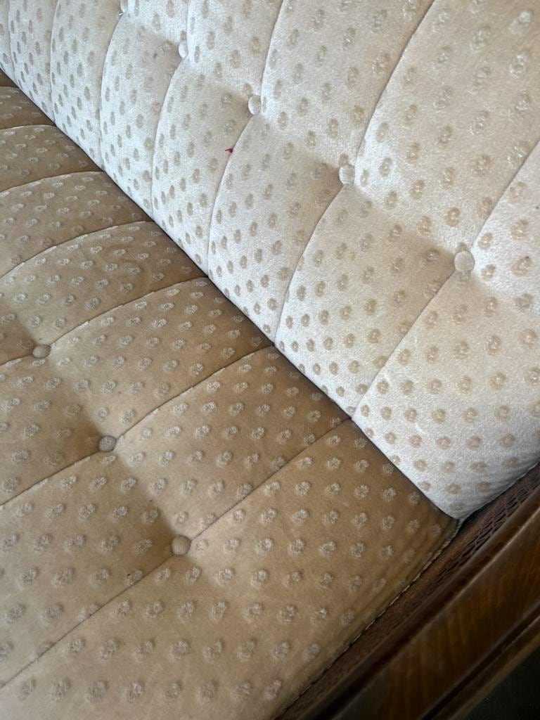 Vintage wooden armchair with rattan weaving.